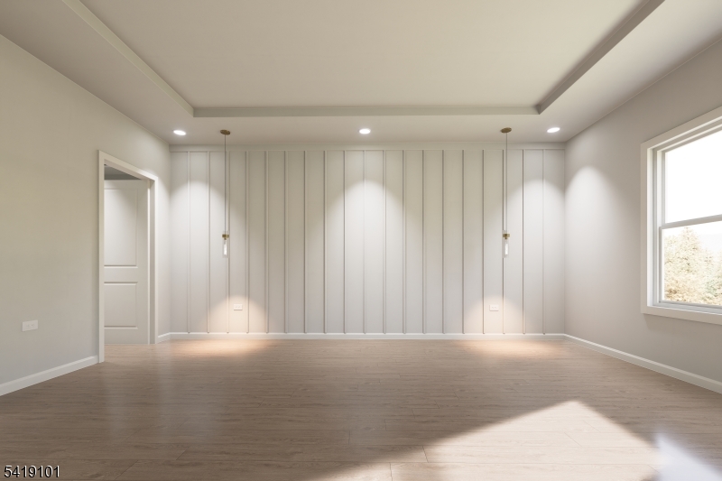 755 River Road Chatham, NJ 07928 - Photo 20 of 24 a view of a big room with windows and chandelier fan