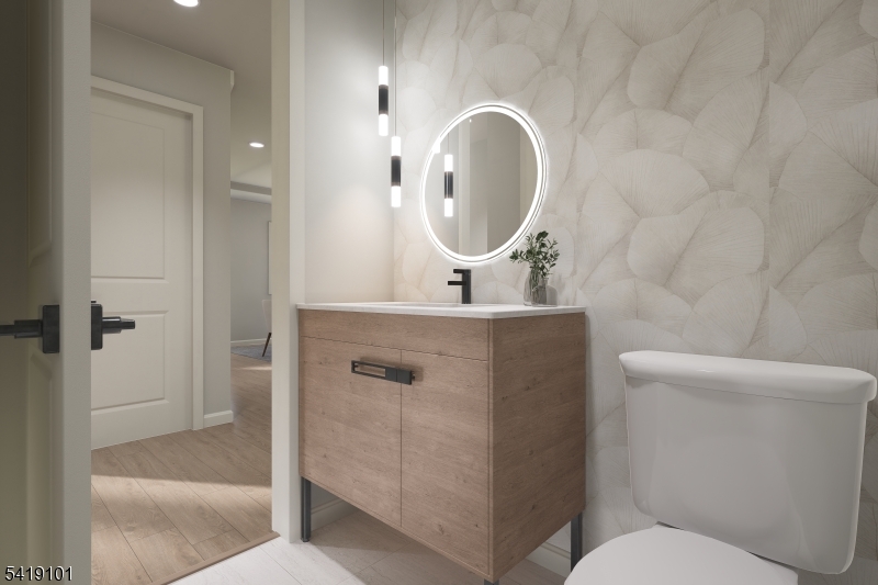 755 River Road Chatham, NJ 07928 - Photo 22 of 24 a bathroom with a toilet sink and mirror