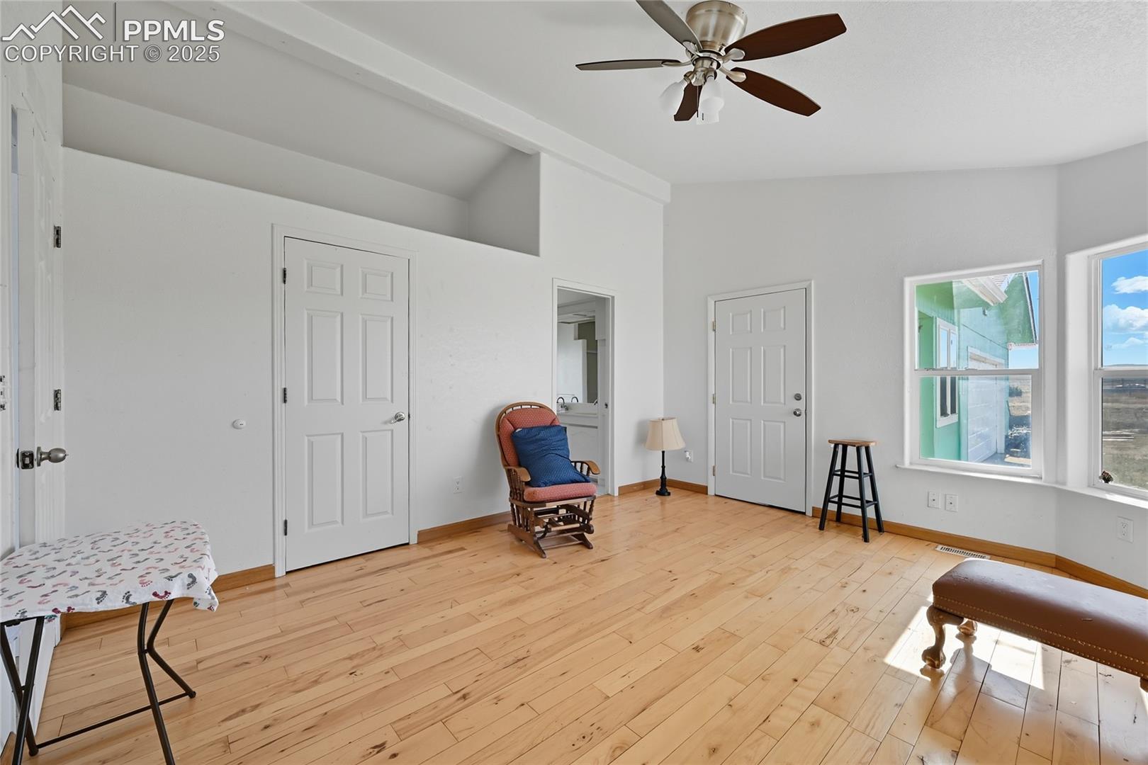 16595 North Yoder Road Calhan, CO 80808 - Photo 6 of 28 Sitting room featuring vaulted ceiling, light wood-style floors, and a ceiling fan