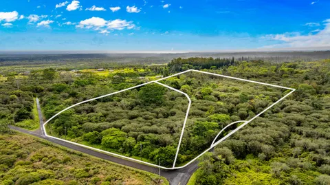 a view of a balcony with lawn chairs