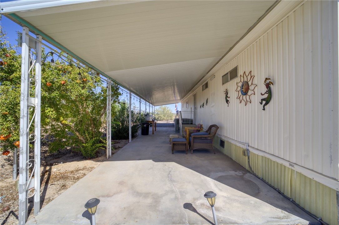 4826 Powell Lake Road Topock, AZ 86436 - Photo 37 of 58 a view of a porch with furniture and garden