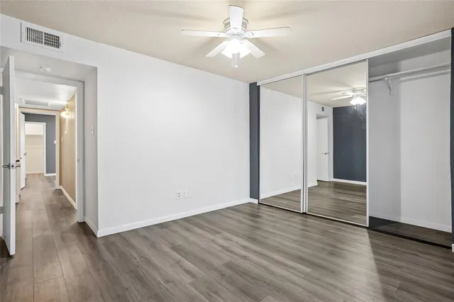 a bathroom with a sink vanity mirror and toilet