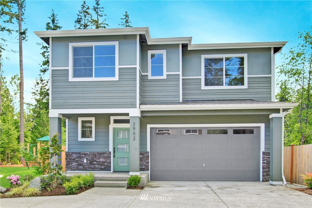 130 180th Place Southwest, Unit CT 03 Bothell, WA 98012 - Photo 2 of 20 a front view of a house with garden