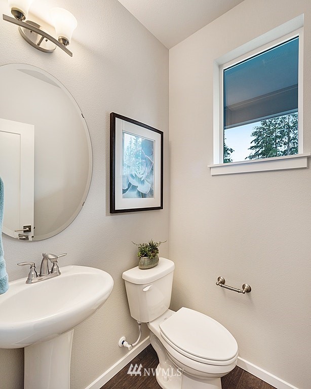 130 180th Place Southwest, Unit CT 03 Bothell, WA 98012 - Photo 8 of 20 a bathroom with a toilet a sink and a mirror