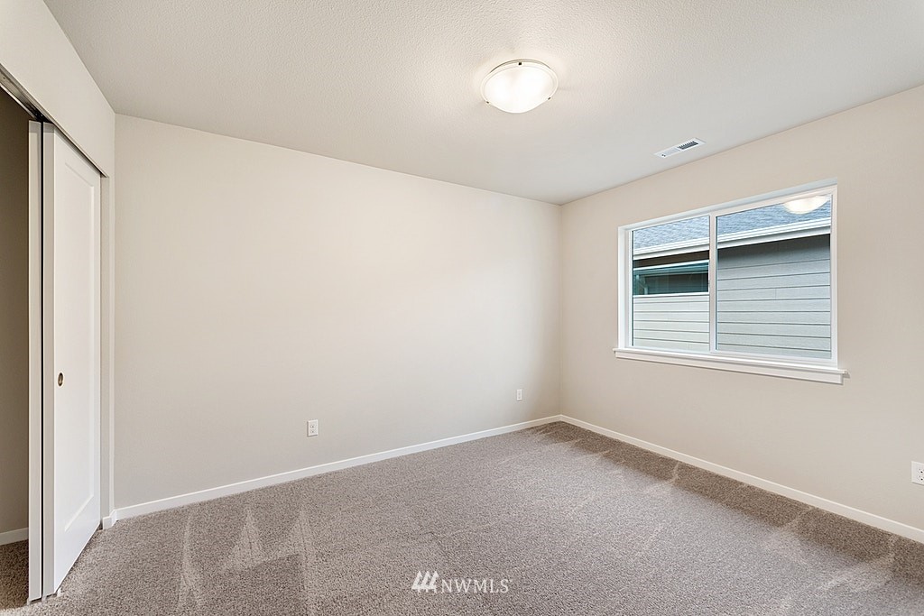 130 180th Place Southwest, Unit CT 03 Bothell, WA 98012 - Photo 10 of 20 a view of an empty room with a window