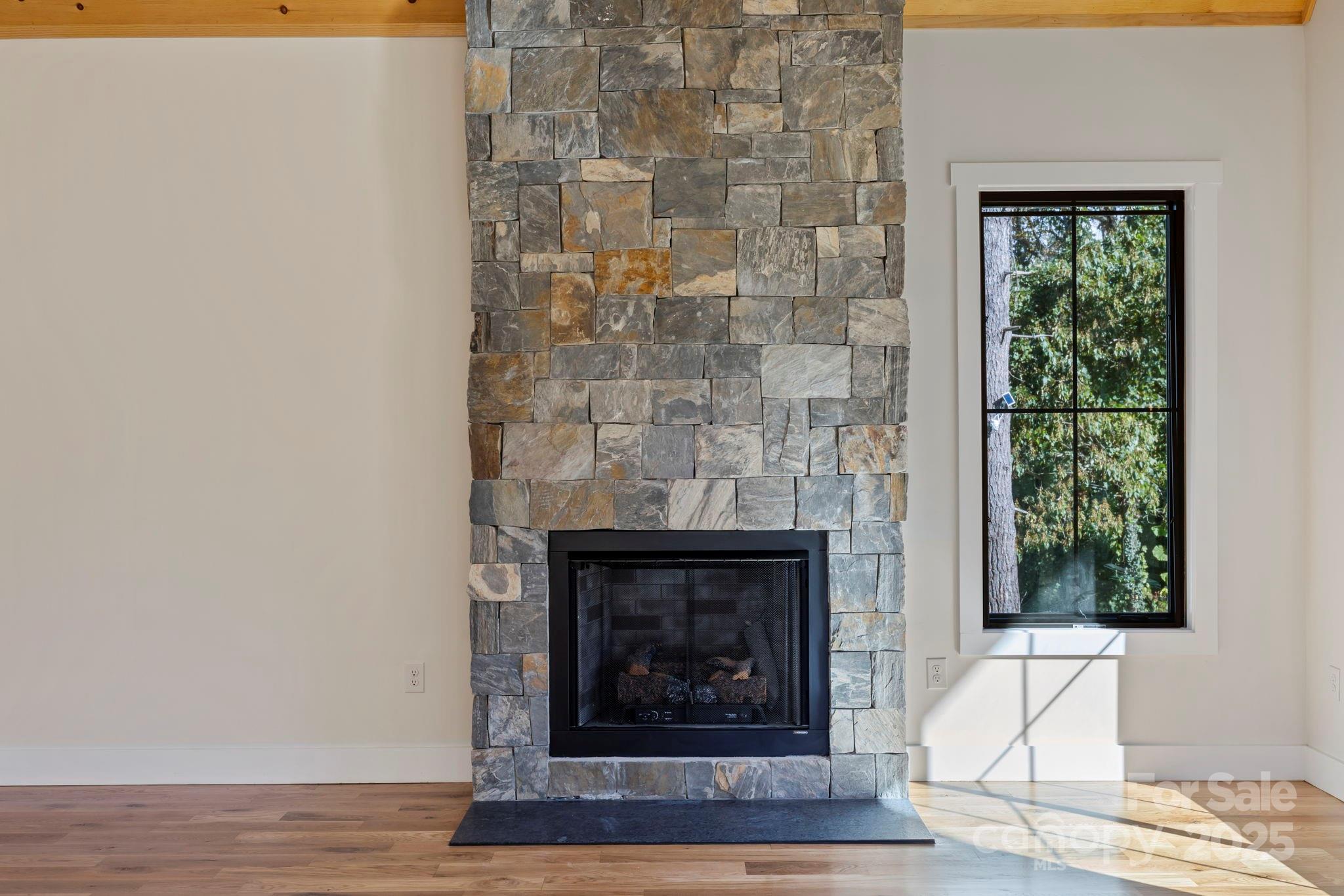 154 Osceola Road Hendersonville, NC 28739 - Photo 16 of 38 a living room with a fireplace