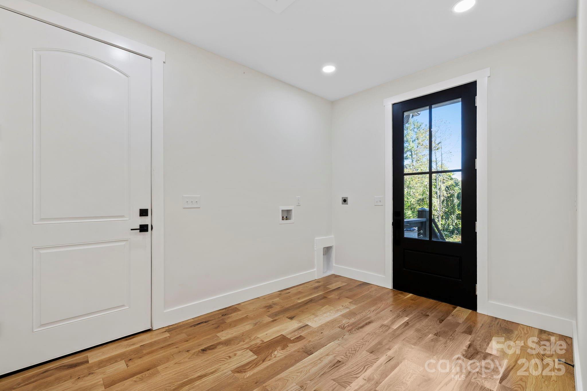 154 Osceola Road Hendersonville, NC 28739 - Photo 27 of 38 a view of an empty room with wooden floor