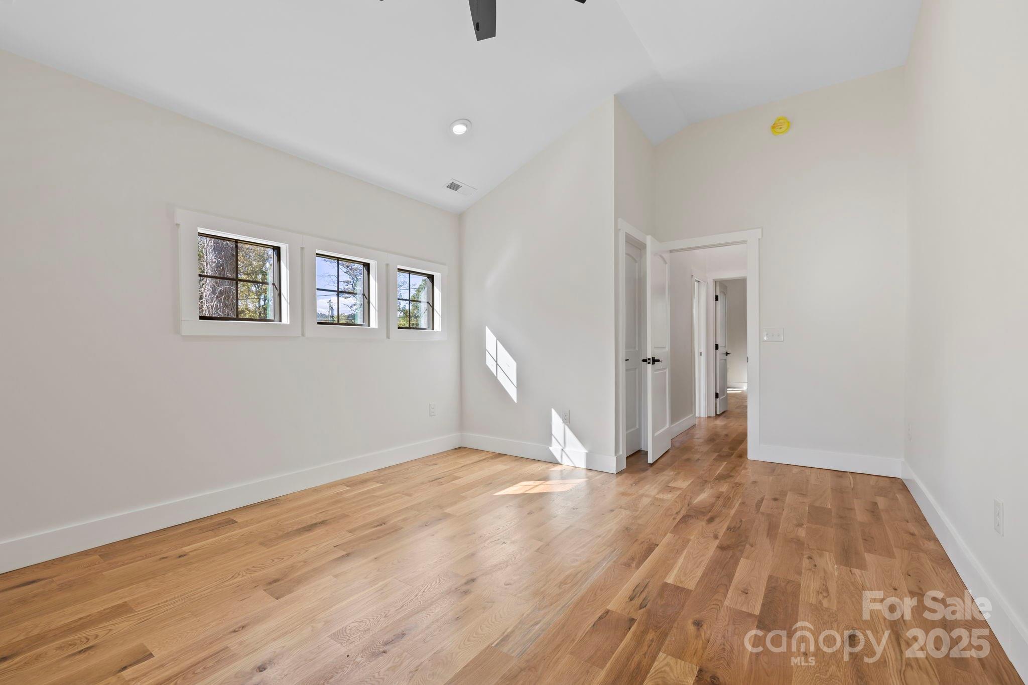 154 Osceola Road Hendersonville, NC 28739 - Photo 35 of 38 a view of an empty room with wooden floor