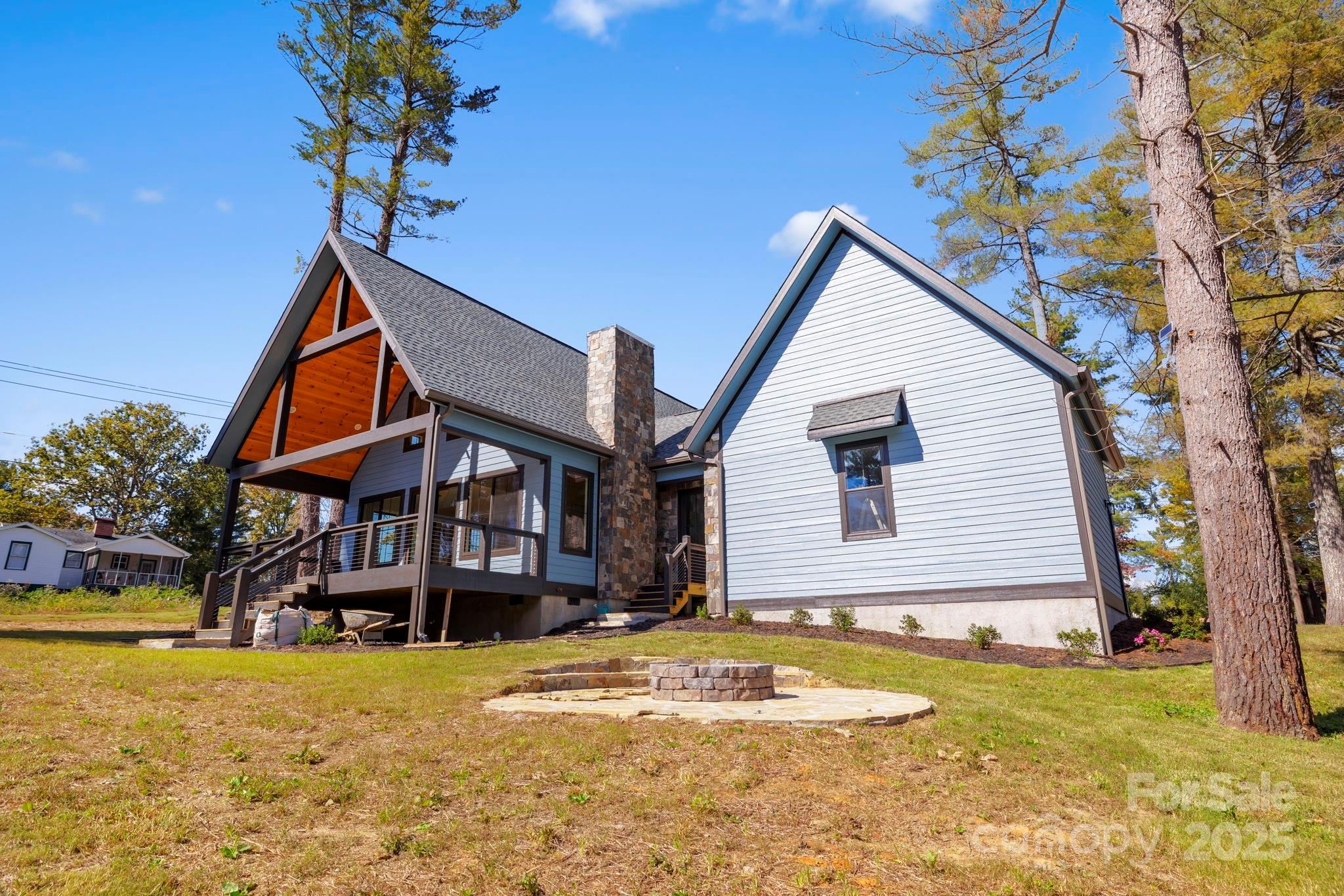 154 Osceola Road Hendersonville, NC 28739 - Photo 7 of 38 a front view of a house with a yard and a garage