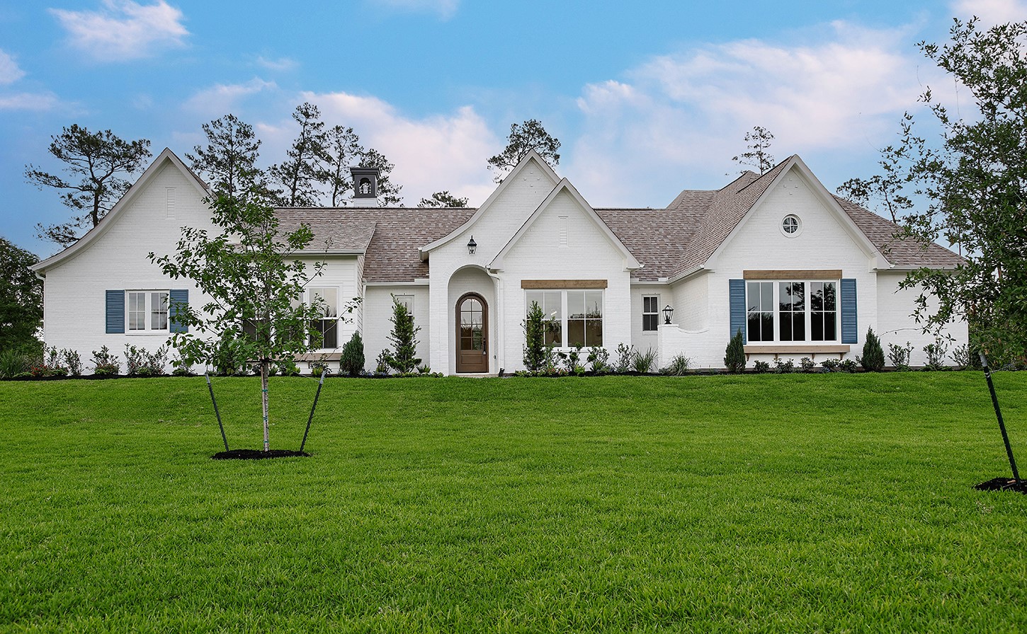 Sprawling custom home crafted by mutli-award-winning Royal Texan Homes, has an elegant and charming curb appeal with fabulous cedar window planter boxes.