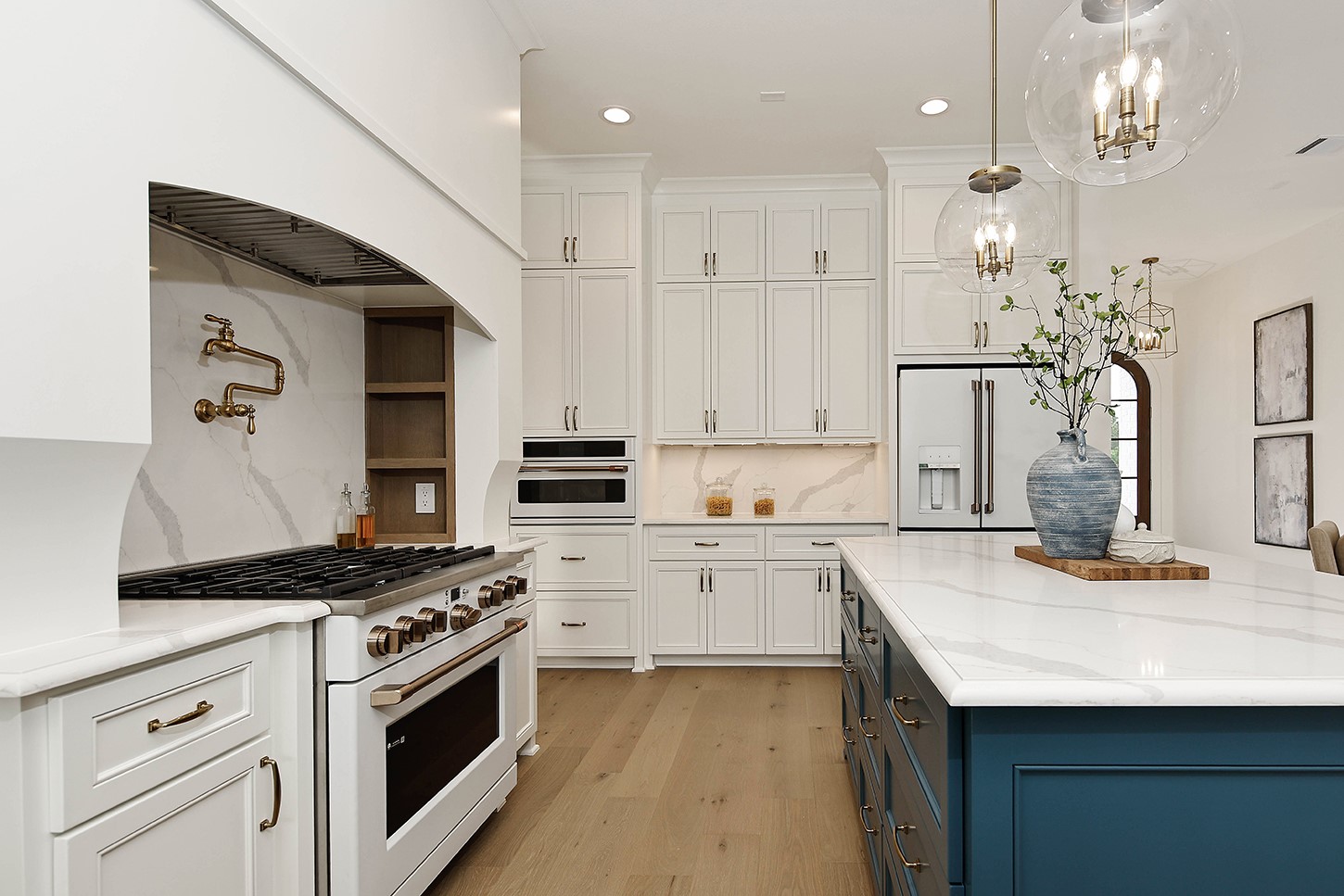 15728 Woodlife Road Willis, TX 77378 - Photo 14 of 36 The finest custom cabinetry extends to ceiling for additional storage, and a convenient built in GE cafe microwave oven.