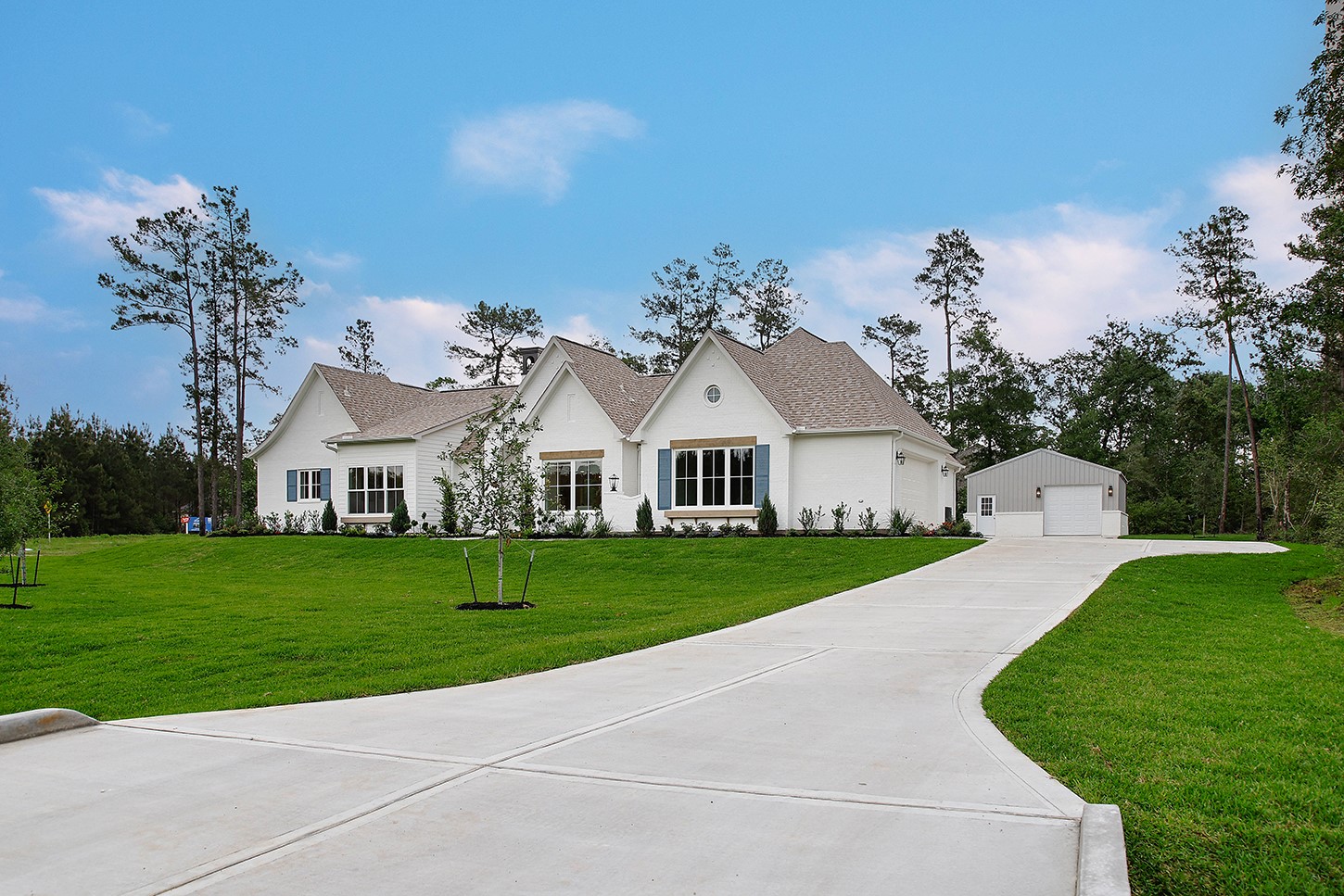 15728 Woodlife Road Willis, TX 77378 - Photo 2 of 36 White brick beauty is primely located on corner 1+ acre lot.