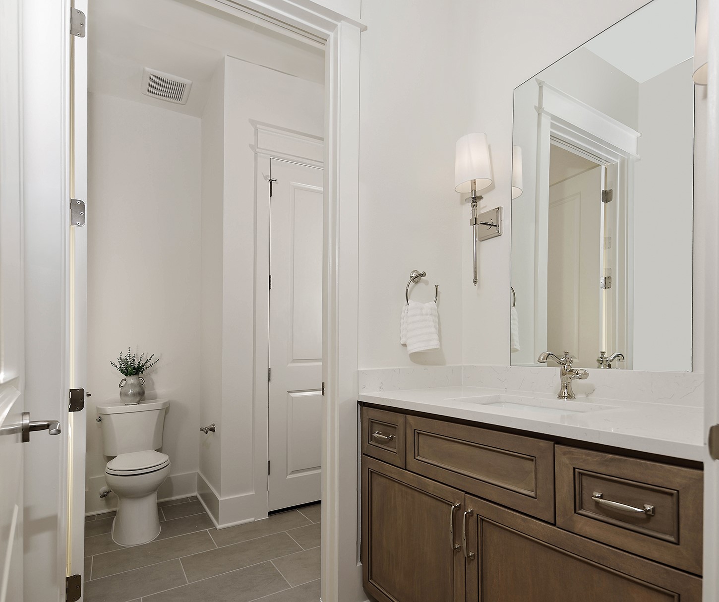 15728 Woodlife Road Willis, TX 77378 - Photo 29 of 36 Bathroom 2 is a Jack & Jill layout shared between both bedrooms with separate vanities and shared tub/shower/toilet. Rich stained wood cabinets with silver fixtures adds elegance.
