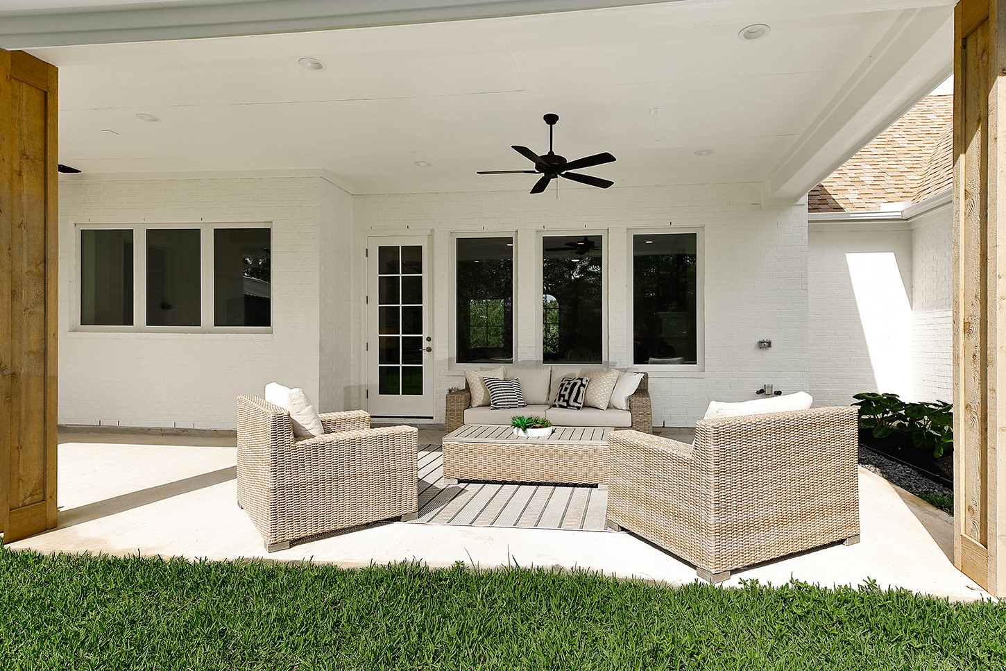 15728 Woodlife Road Willis, TX 77378 - Photo 31 of 36 Gorgeous covered lanai in back is spacious for enjoying comfortable outdoor lounging.