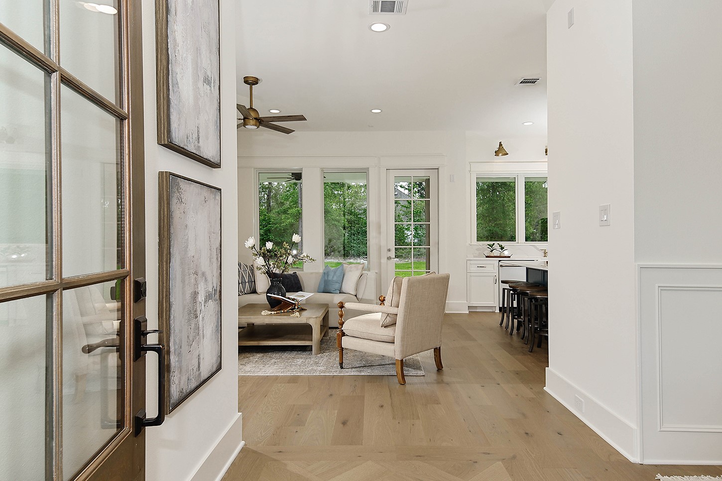 15728 Woodlife Road Willis, TX 77378 - Photo 7 of 36 Step inside and notice the inviting designer color palette, premium finishes, and sight line to windows and glorious trees.