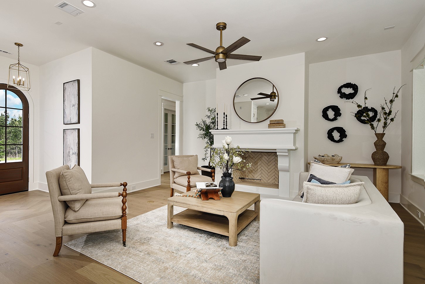 15728 Woodlife Road Willis, TX 77378 - Photo 10 of 36 Inviting living room has a custom statement fireplace, adding depth to space and anchoring this room well.