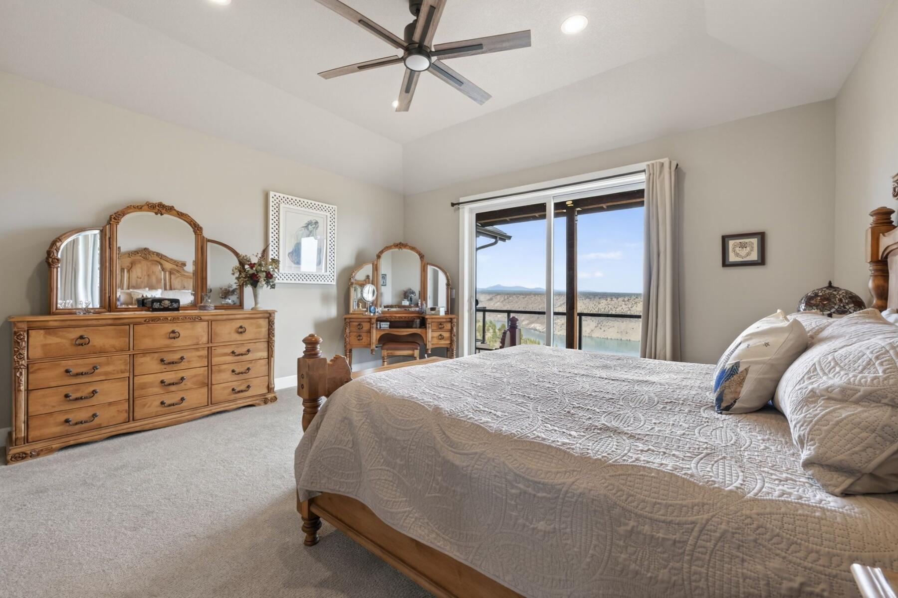 11620 Southwest Pixie Lane Culver, OR 97734 - Photo 24 of 53 a bedroom with a bed a dresser and a large mirror