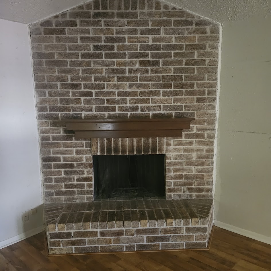 6443 Allerton Street Houston, TX 77084 - Photo 17 of 18 Beautiful brick fireplace in livingroom