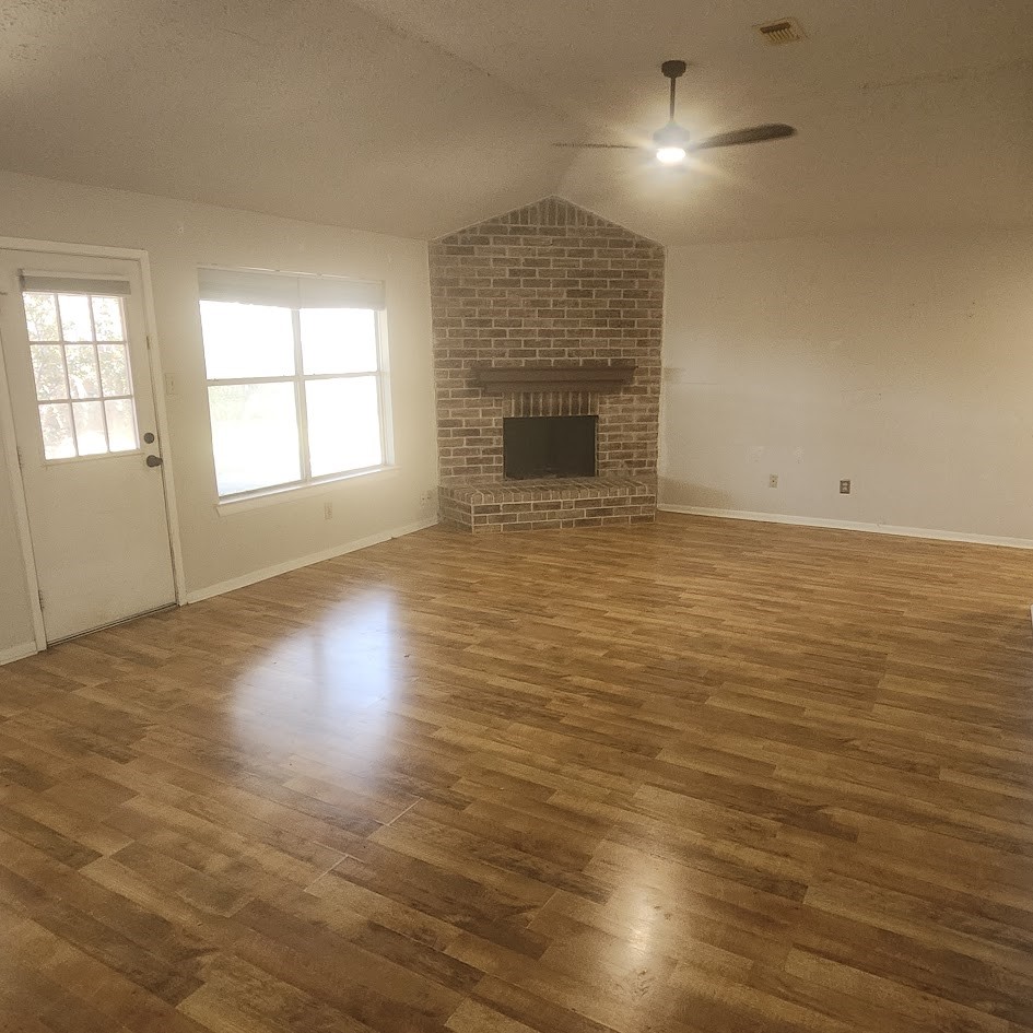 6443 Allerton Street Houston, TX 77084 - Photo 4 of 18 Real hardwood floors with fireplace
