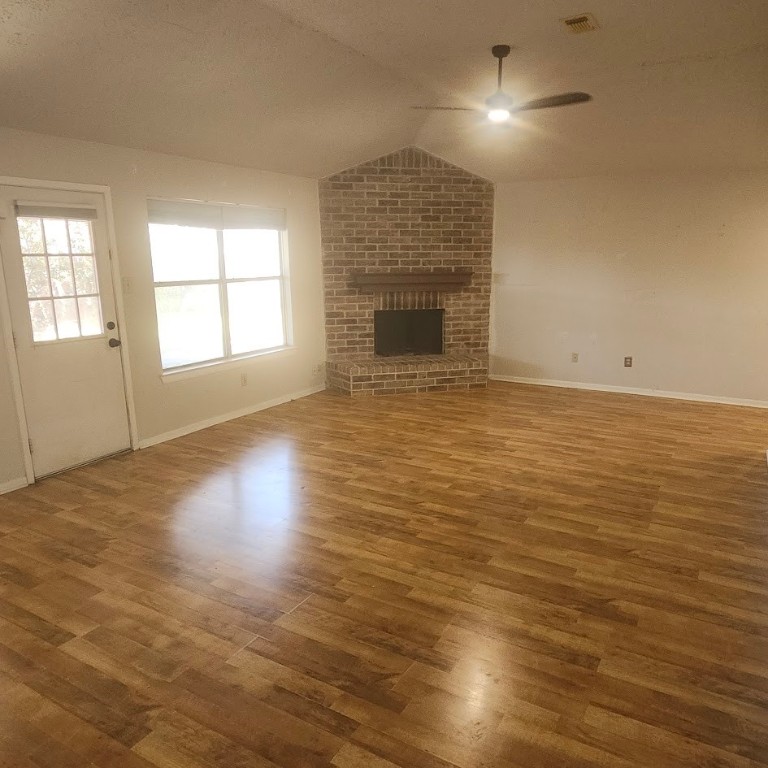 6443 Allerton Street Houston, TX 77084 - Photo 4 of 18 an empty room with wooden floor and windows
