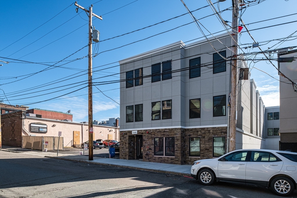 1540 North Shore Road, Unit 302 Revere, MA 02151 - Photo 14 of 15 a car parked in front of a building