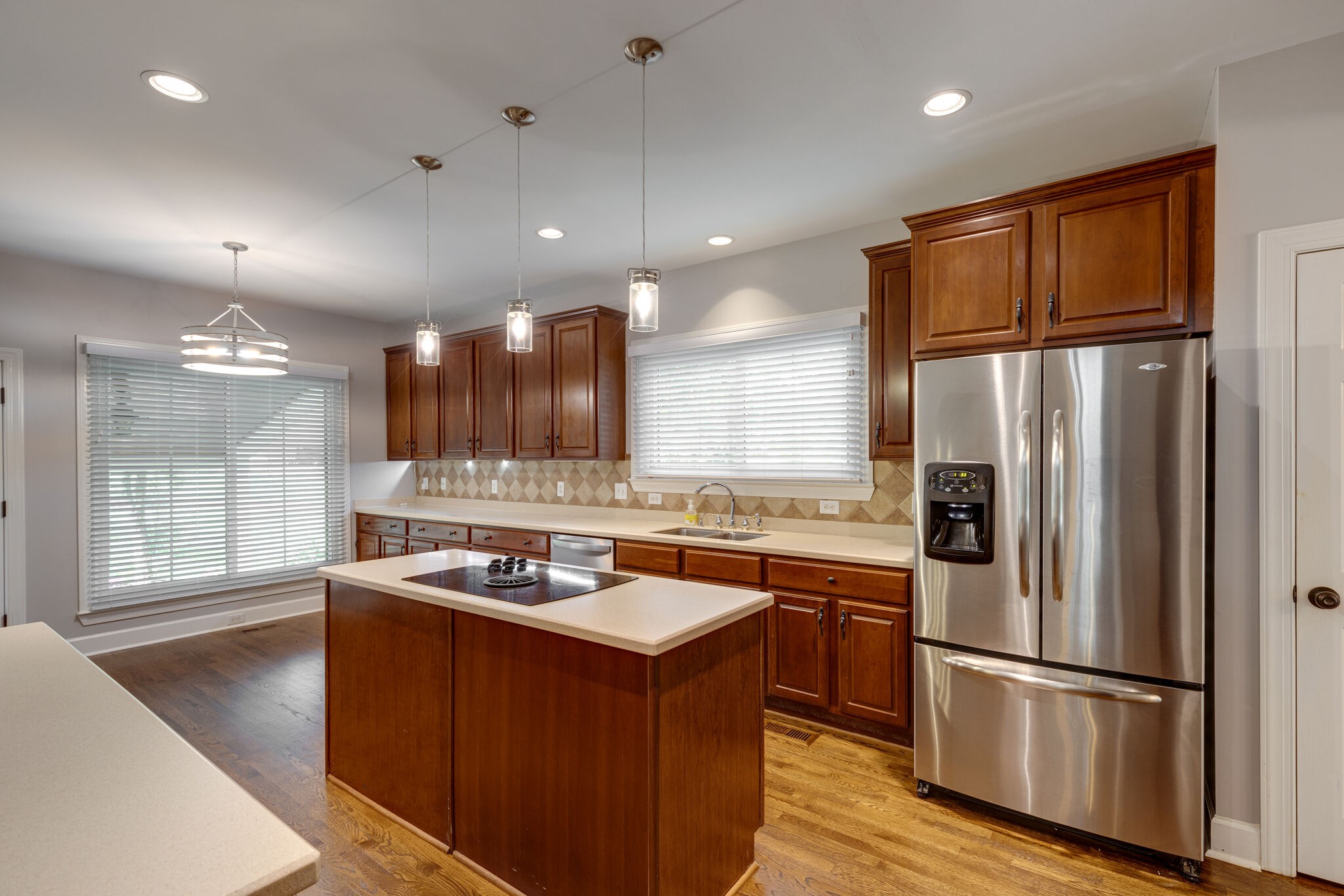 119 Richards Glen Drive Franklin, TN 37067 - Photo 12 of 41 a kitchen with kitchen island stainless steel appliances a sink stove and refrigerator