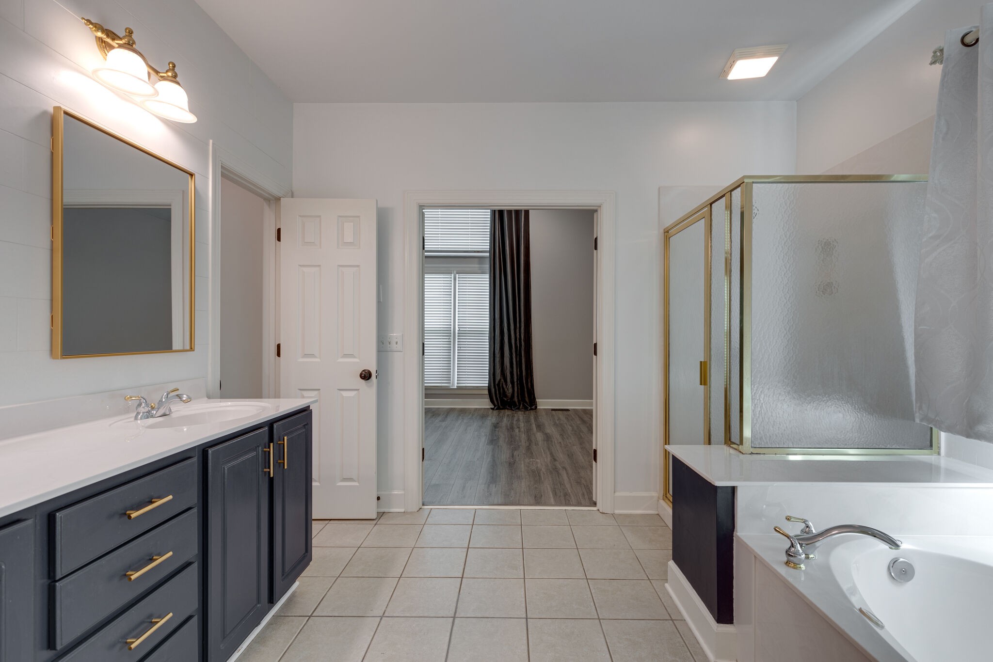 119 Richards Glen Drive Franklin, TN 37067 - Photo 22 of 41 a bathroom with a sink a mirror and a shower