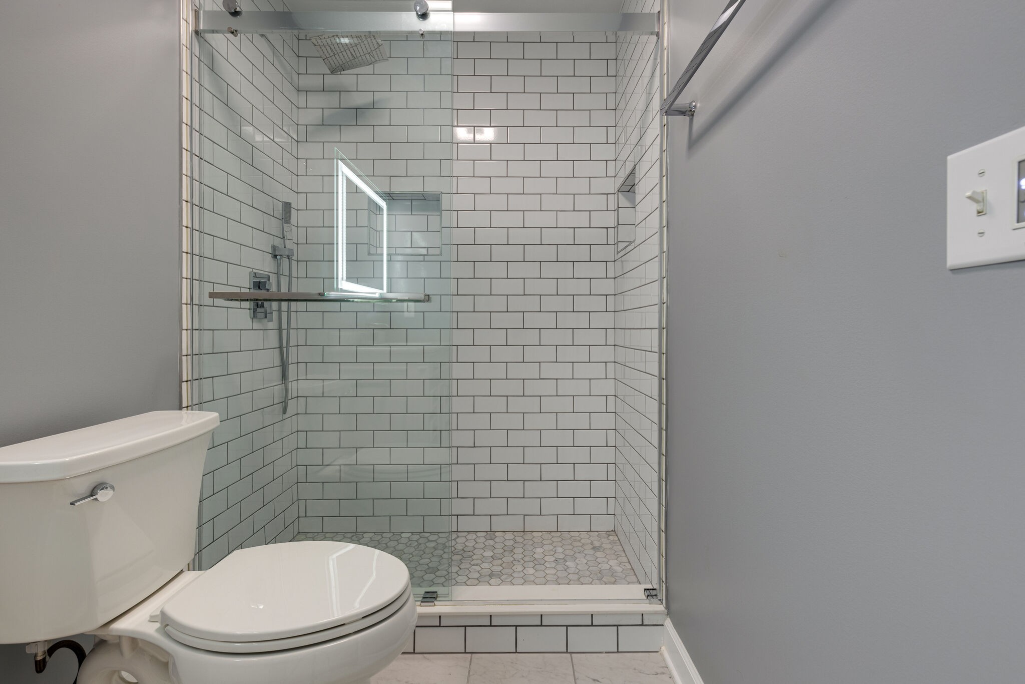 119 Richards Glen Drive Franklin, TN 37067 - Photo 36 of 41 a white toilet sitting next to a shower