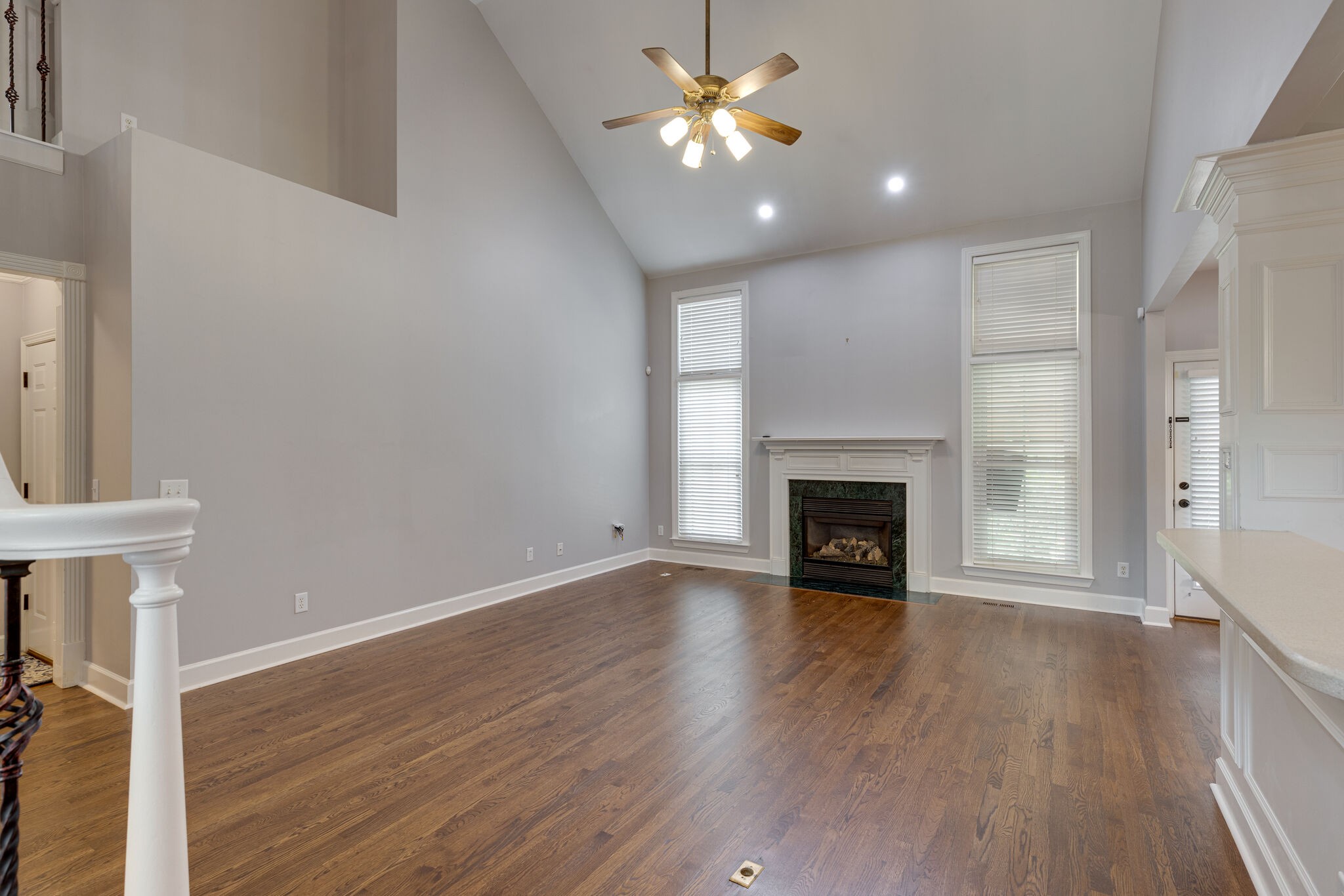119 Richards Glen Drive Franklin, TN 37067 - Photo 4 of 41 a view of an empty room with wooden floor fireplace and a window