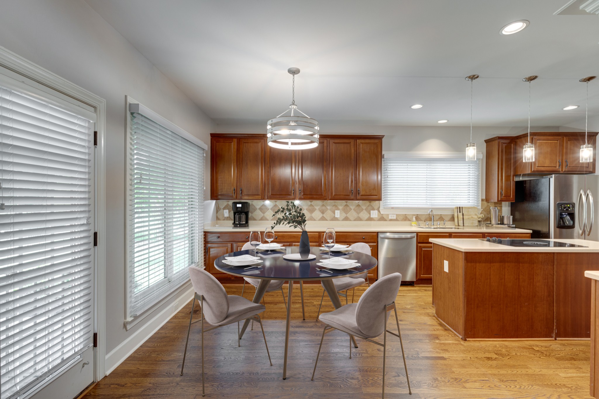 119 Richards Glen Drive Franklin, TN 37067 - Photo 8 of 41 a view of a dining room with furniture a chandelier and wooden floor