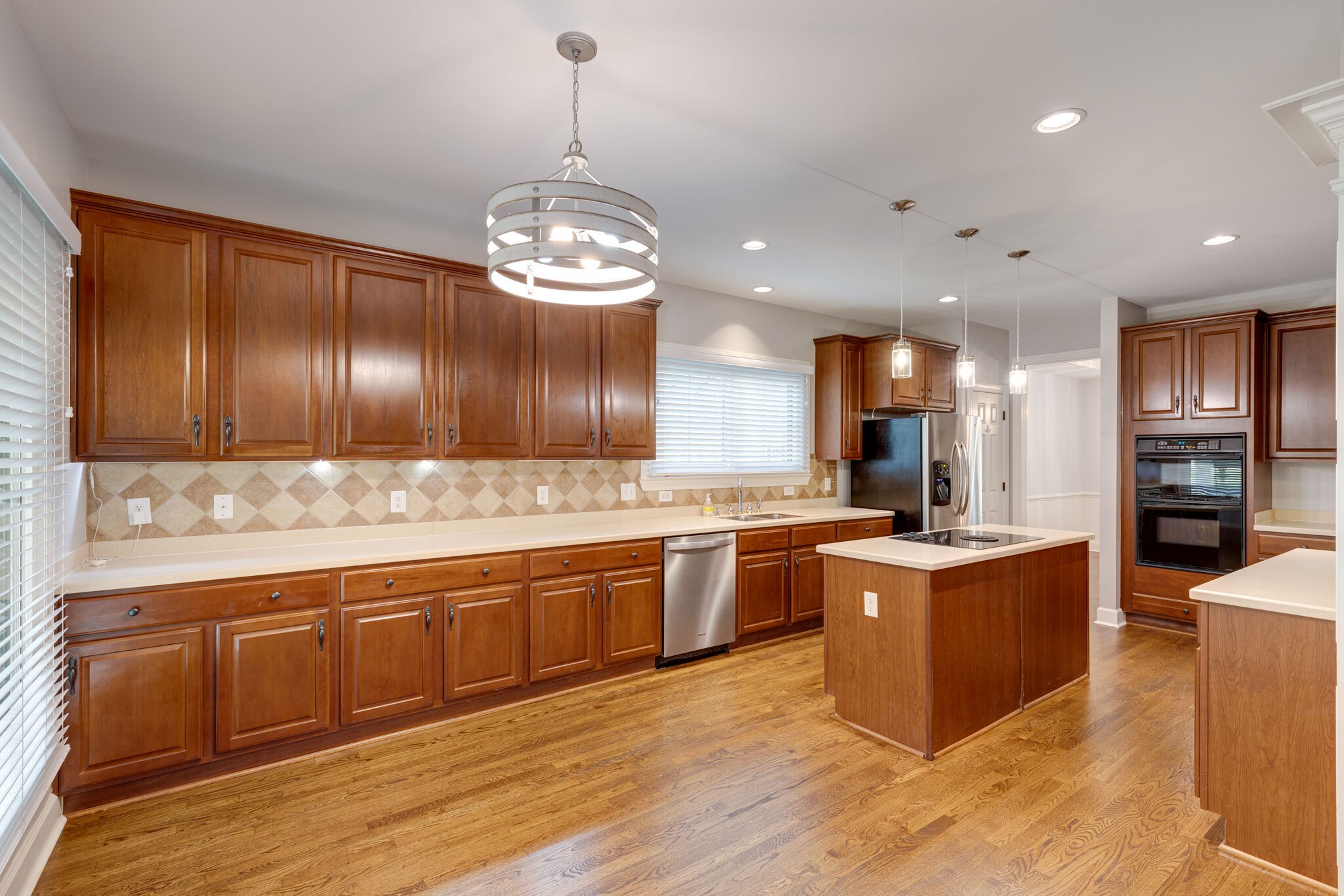 119 Richards Glen Drive Franklin, TN 37067 - Photo 10 of 41 a large kitchen with stainless steel appliances kitchen island granite countertop wooden cabinets and a dishwasher