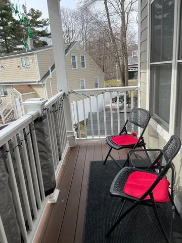 a view of a deck with furniture