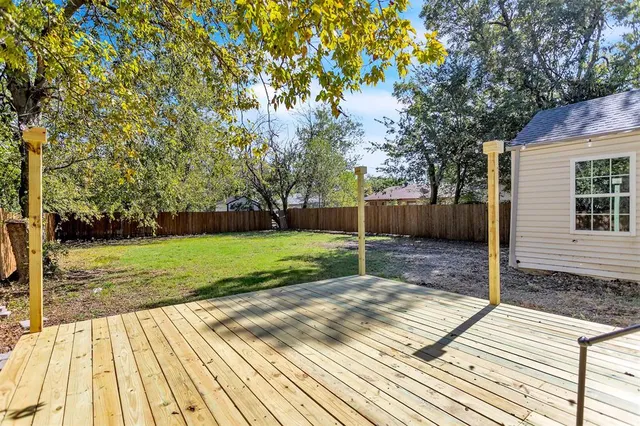 a view of backyard with green space