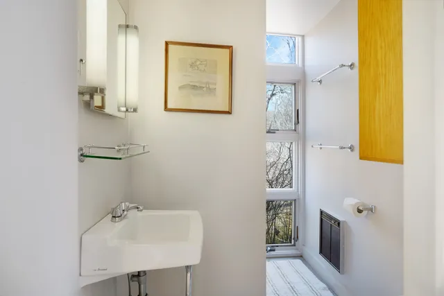 a view of balcony with chairs wooden floor and fence