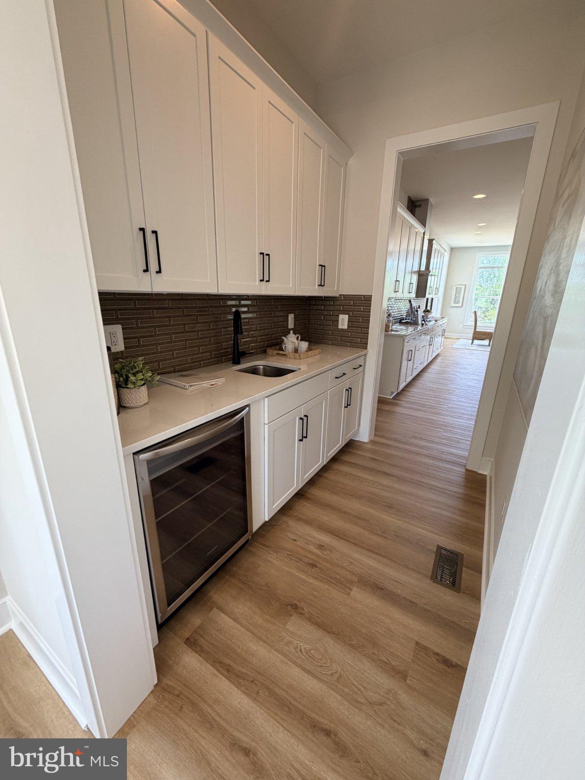 300 Compass Cove Mineral, VA 23117 - Photo 14 of 22 Sleek kitchen corridor with modern flair.