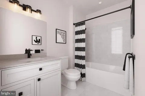 a bathroom with a sink a toilet and a bathtub