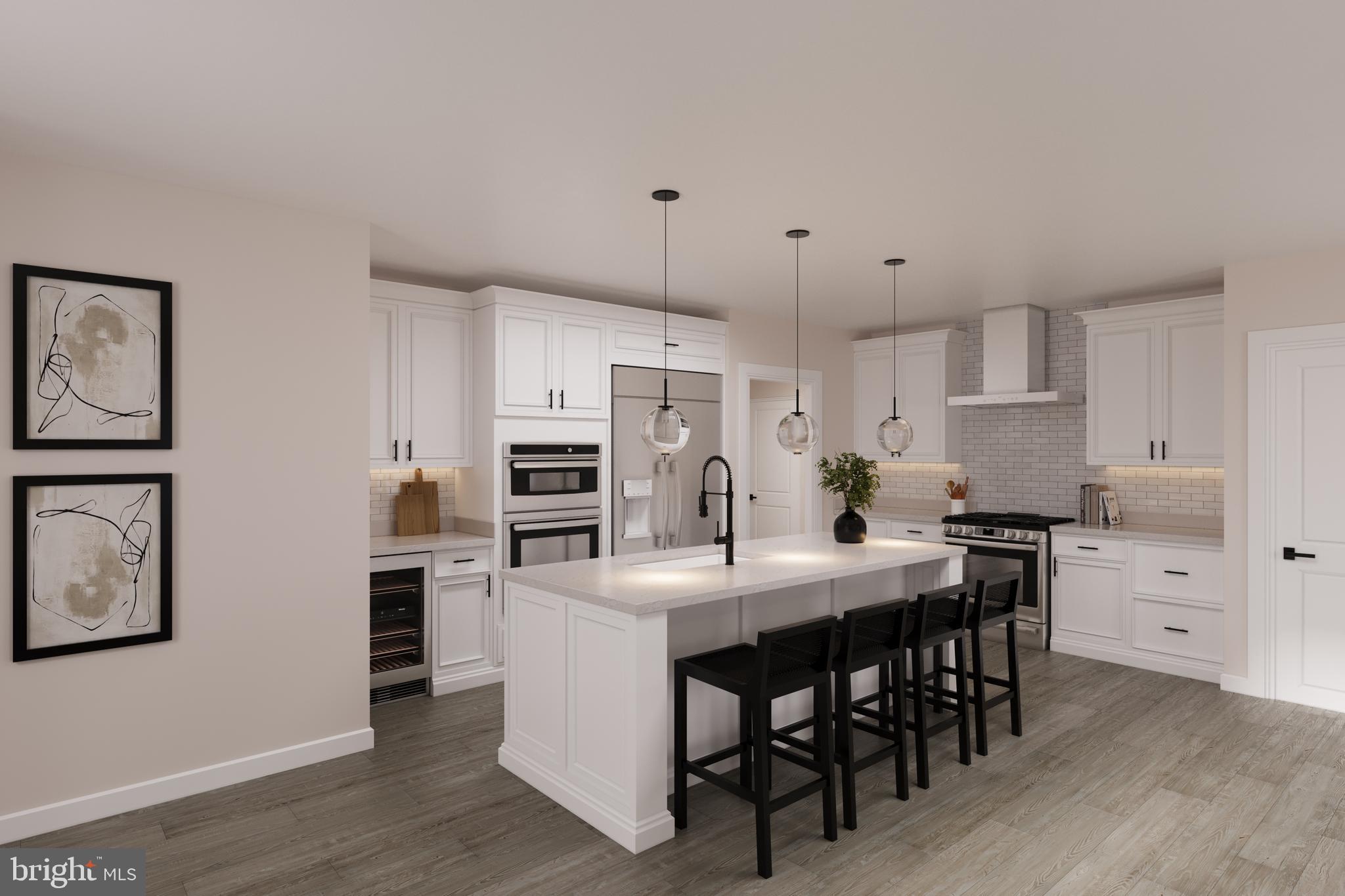 7 Blazing Star Street Frederick, MD 21702 - Photo 3 of 15 a kitchen with granite countertop a table chairs stainless steel appliances and wooden floor