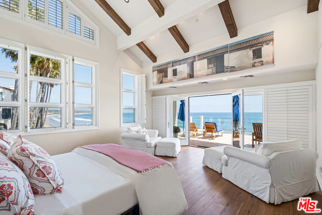 31444 Broad Beach Road Malibu, CA 90265 - Photo 12 of 36 a bedroom with furniture and a large window