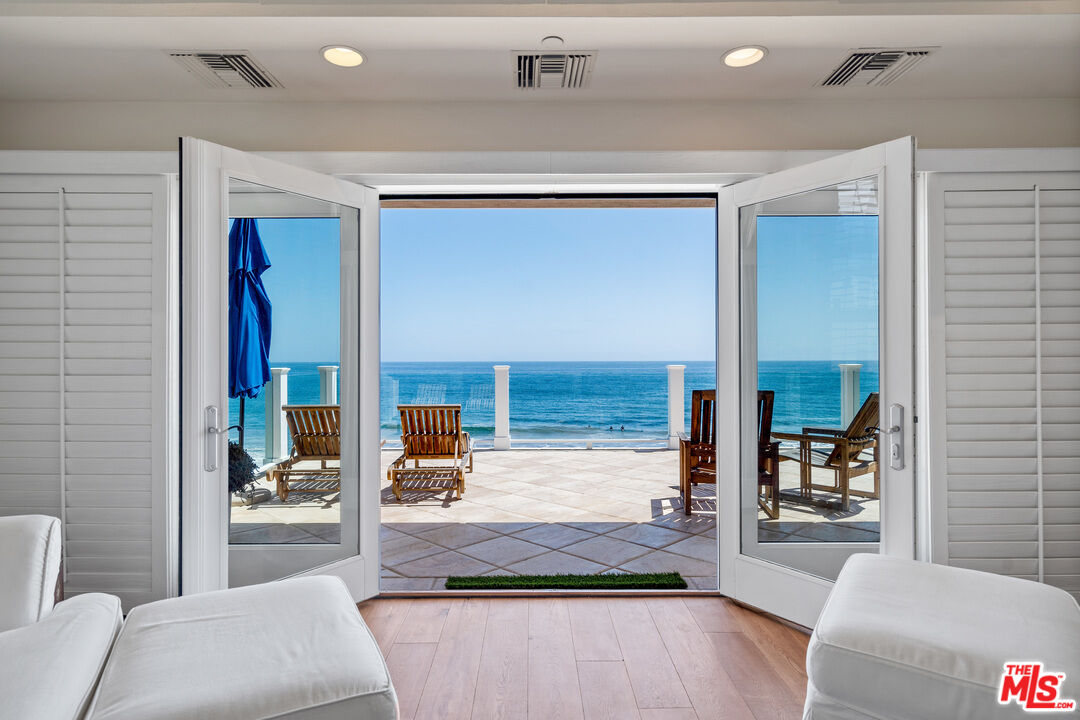 31444 Broad Beach Road Malibu, CA 90265 - Photo 14 of 36 a living room with furniture and a fireplace