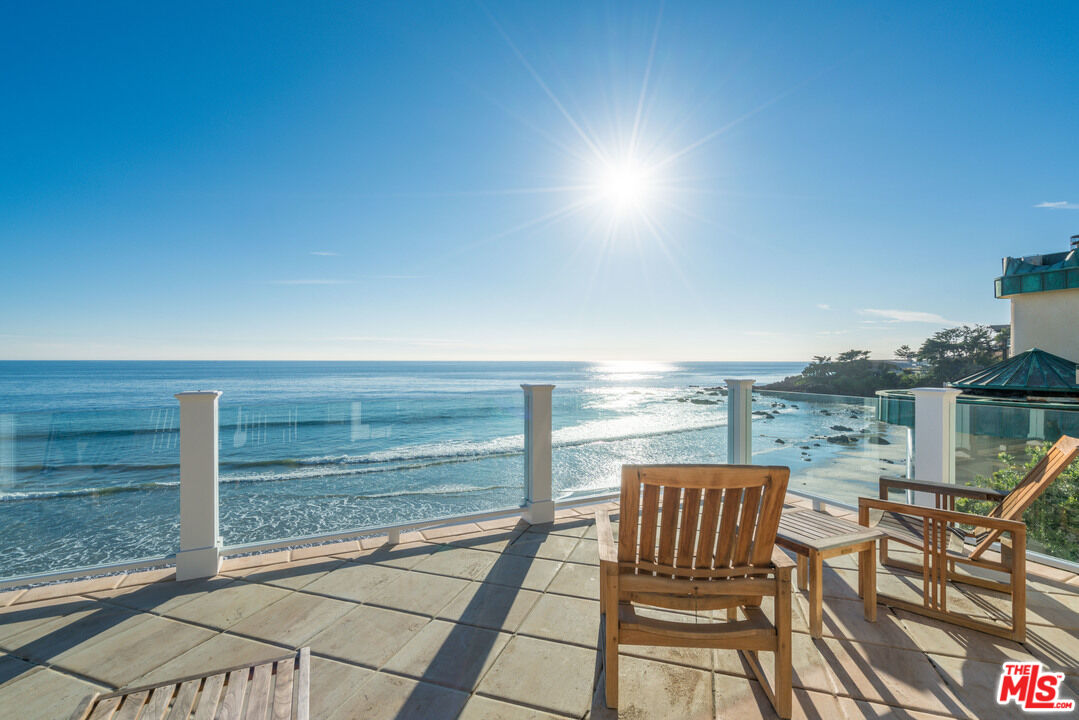 31444 Broad Beach Road Malibu, CA 90265 - Photo 16 of 36 a view of a balcony with lake view and wooden floor