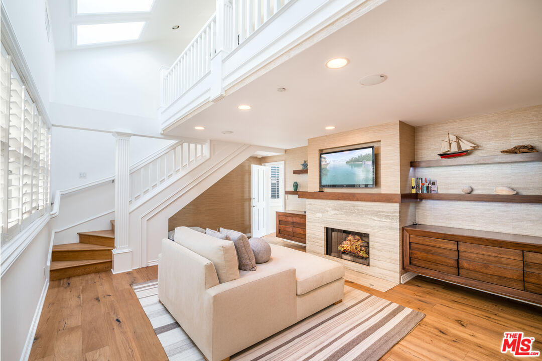 31444 Broad Beach Road Malibu, CA 90265 - Photo 21 of 36 a living room with furniture and a fireplace