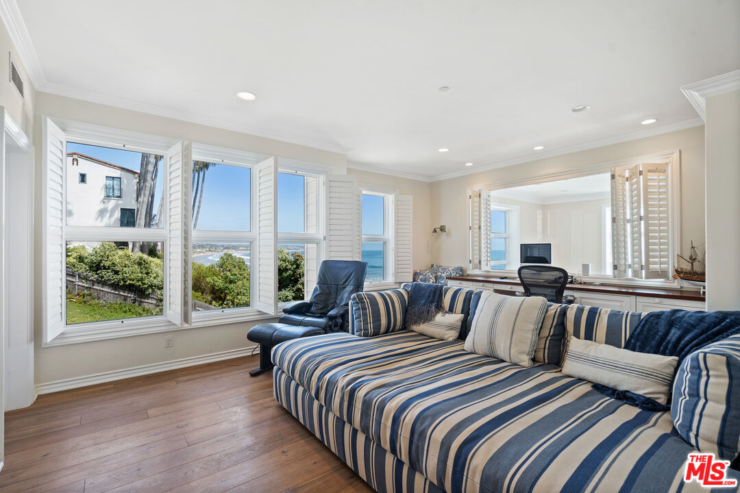 31444 Broad Beach Road Malibu, CA 90265 - Photo 25 of 36 a bedroom with furniture and windows