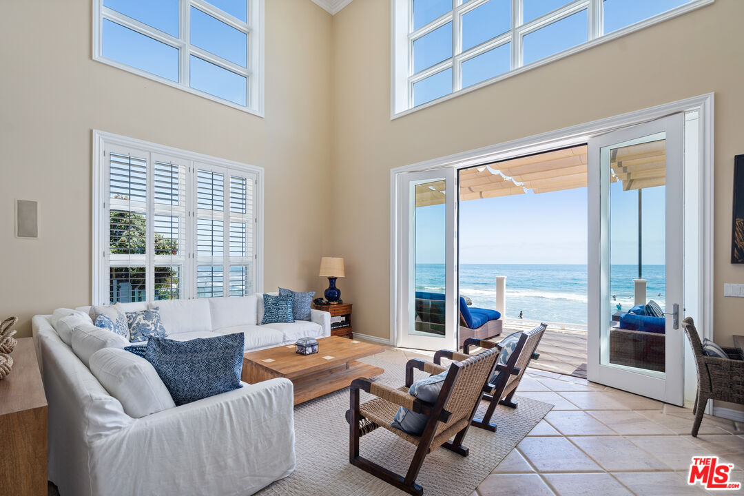 31444 Broad Beach Road Malibu, CA 90265 - Photo 6 of 36 a living room with furniture and floor to ceiling windows