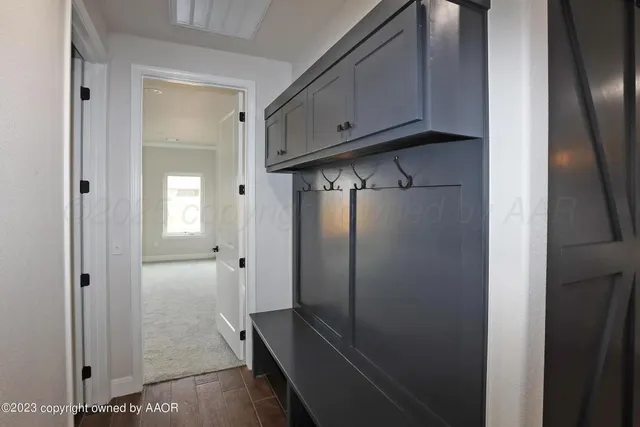 a view of a storage and utility room with closet