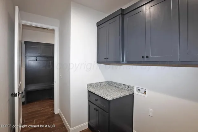 a kitchen with a sink and cabinets