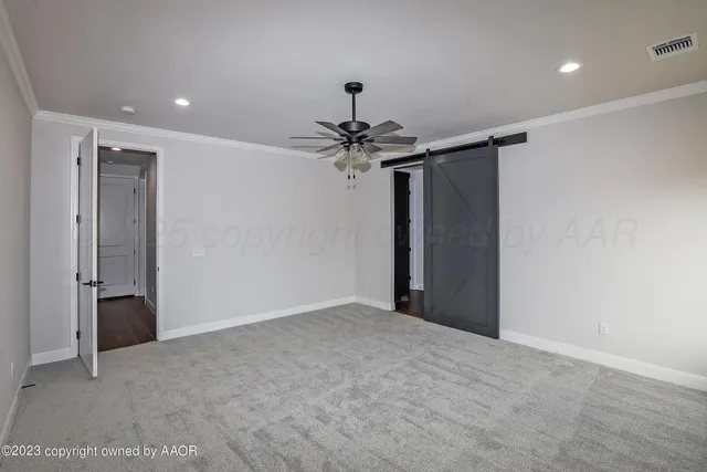 a view of a chandelier fan in a room