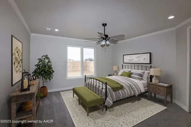 a bedroom with a bed and a potted plant