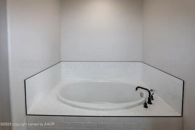 a bathroom with a white bath tub