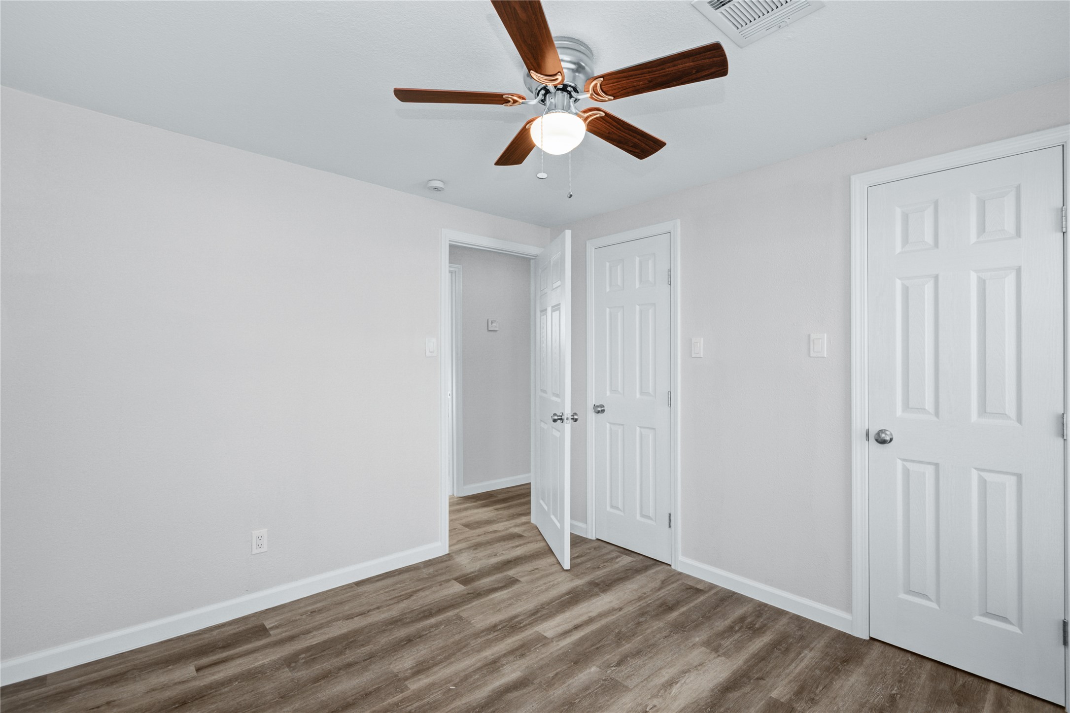207 East Bernard Street Clute, TX 77531 - Photo 15 of 25 wooden floor in an empty room