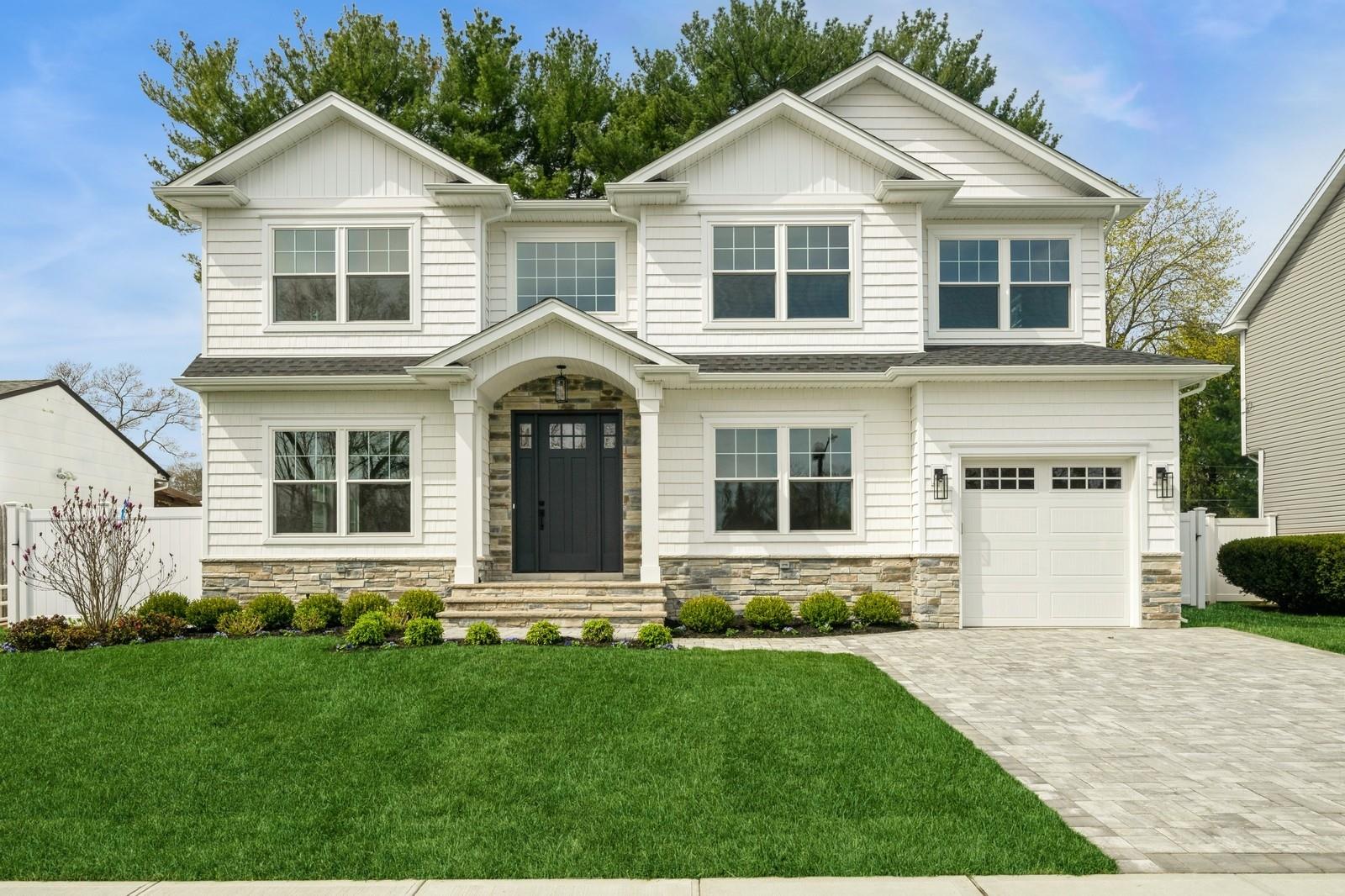 16 Gordon Avenue Plainview, NY 11803 - Photo 1 of 1 a front view of a house with a yard